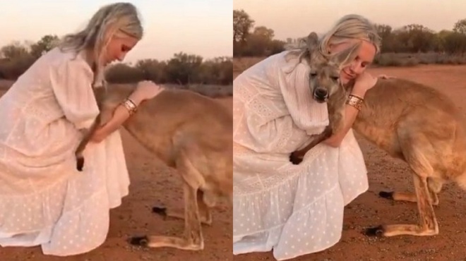 gynaika-parigorei-kai-agkaliazei-pyroplikto-kagkoyro-kai-i-eikona-kanei-to-gyro-toy-kosmoy-57000